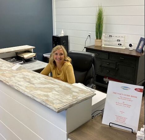 a woman receptionist smiles